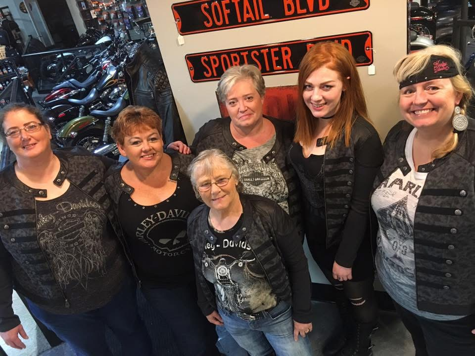May be an image of 5 people, motorcycle and text