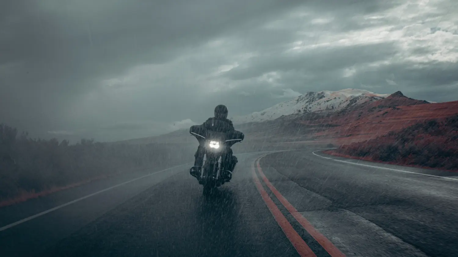 A person rides a 2025 Harley-Davidson® Street Glide® through the rain in Stuart, FL, capturing the spirit of adventure.