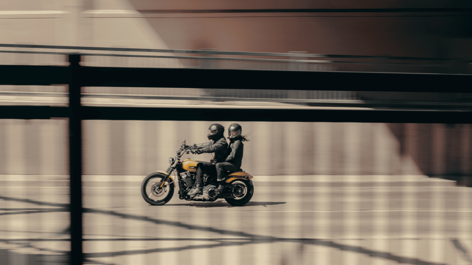 A man on a 2025 Harley-Davidson® Street Bob® motorcycle cruising down a street in Stuart, FL, available at Treasure Coast Harley-Davidson®.
