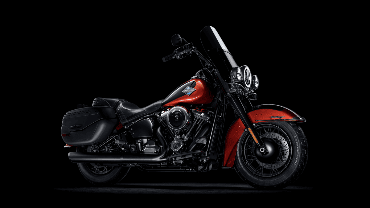 2025 Harley-Davidson® Heritage Classic in red and black finish, photographed on a black background near Sanford, FL