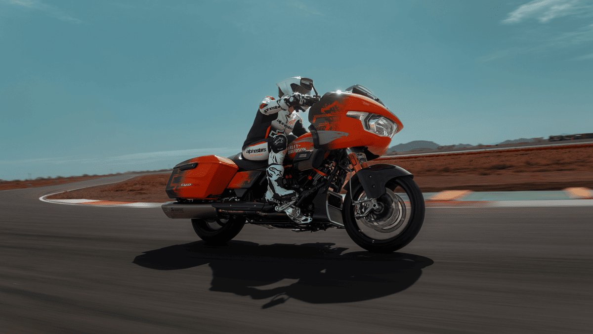 Rider leaning through track curve on 2025 Harley-Davidson® CVO™ Road Glide® RR near Sanford, FL—race-inspired performance in motion