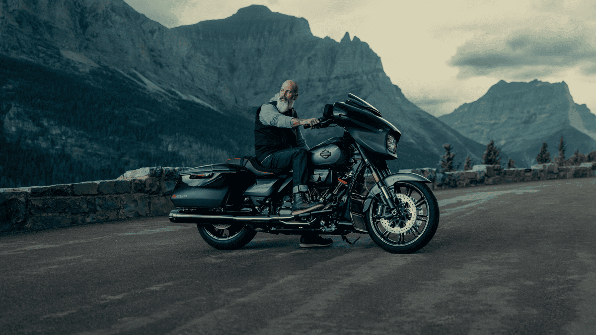 Rider on a 2025 Harley-Davidson® CVO™ Street Glide® in the mountains near Orlando, FL—aggressive stance and elite design