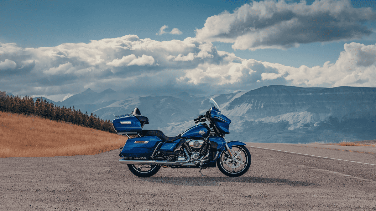 2025 Harley-Davidson® Street Glide® Ultra in vivid blue on a mountain highway near Orlando, FL—ultimate touring companion