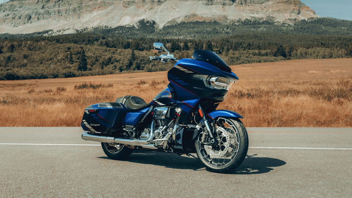 2025 Harley-Davidson® CVO™ Road Glide® in blue set against a scenic Orlando landscape—luxury touring redefined