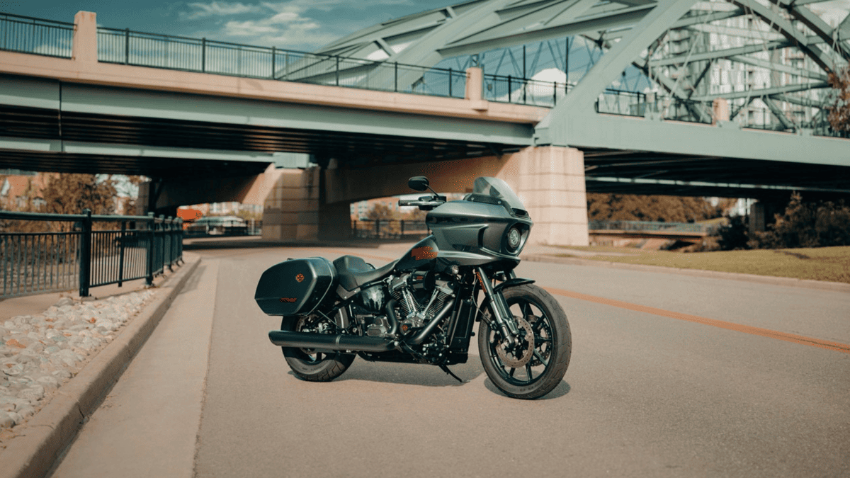Parked 2025 Harley-Davidson® Low Rider® ST near Sanford FL with matte finish, captured under a green overpass bridge on a quiet street.
