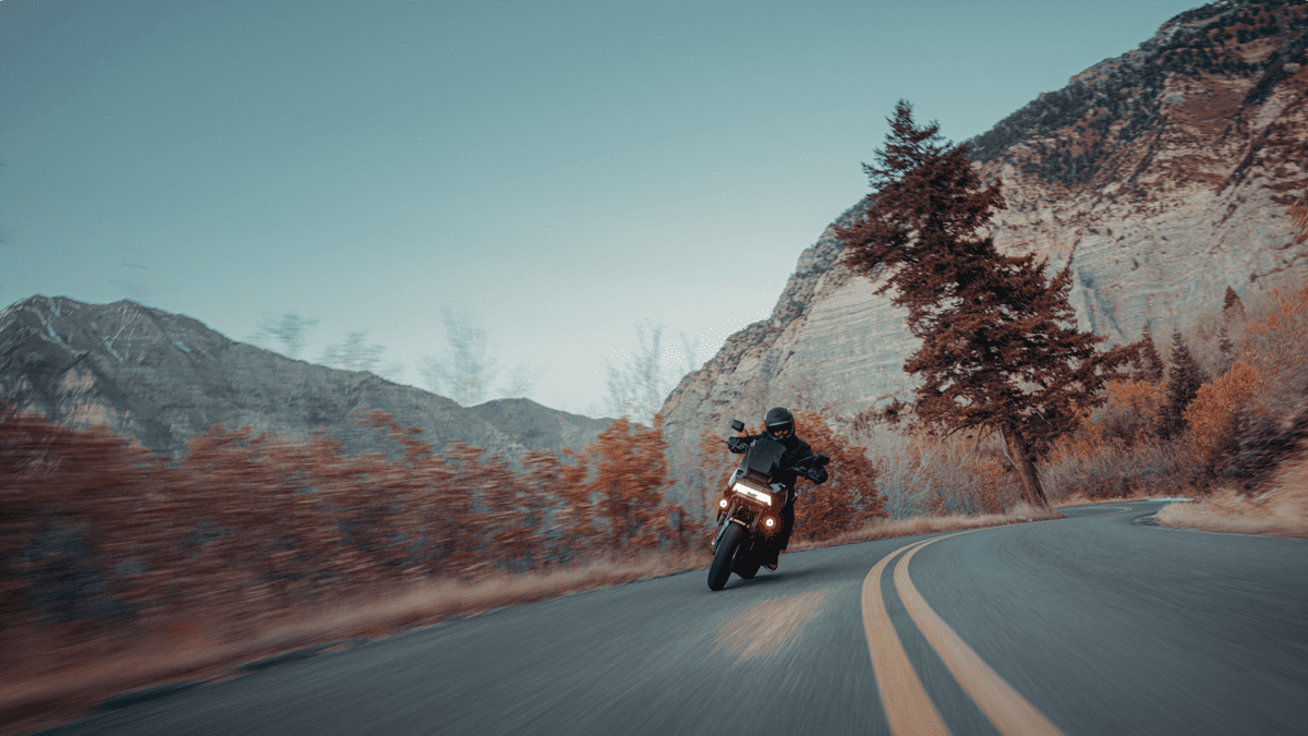 2025 Harley-Davidson® Pan America® 1250 ST navigating winding mountain roads, ideal for Sanford FL adventure riders.
