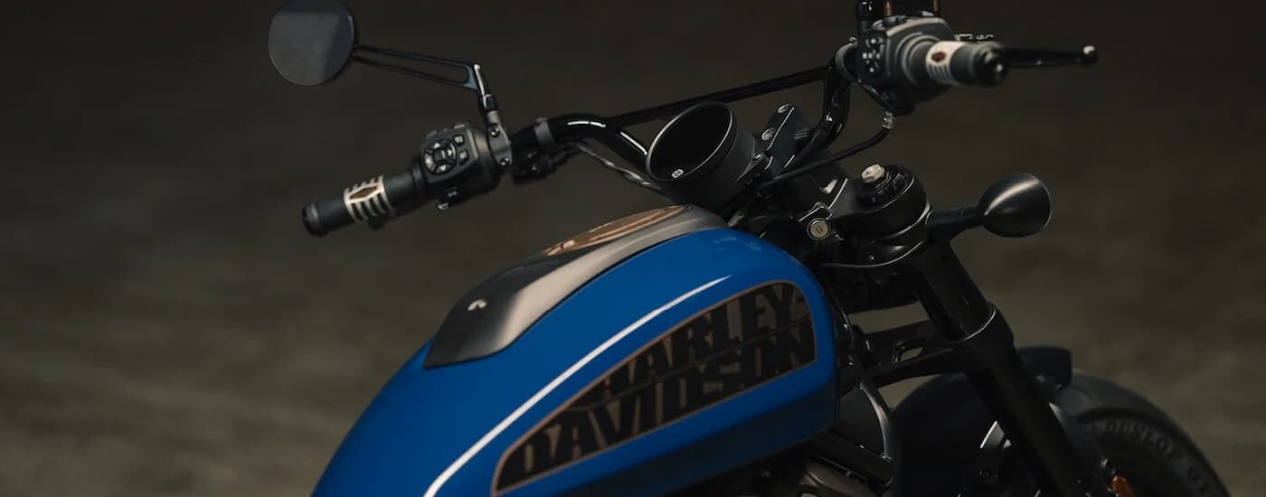 A close up of the body on a blue 2022 Harley-Davidson Sportser S is shown.