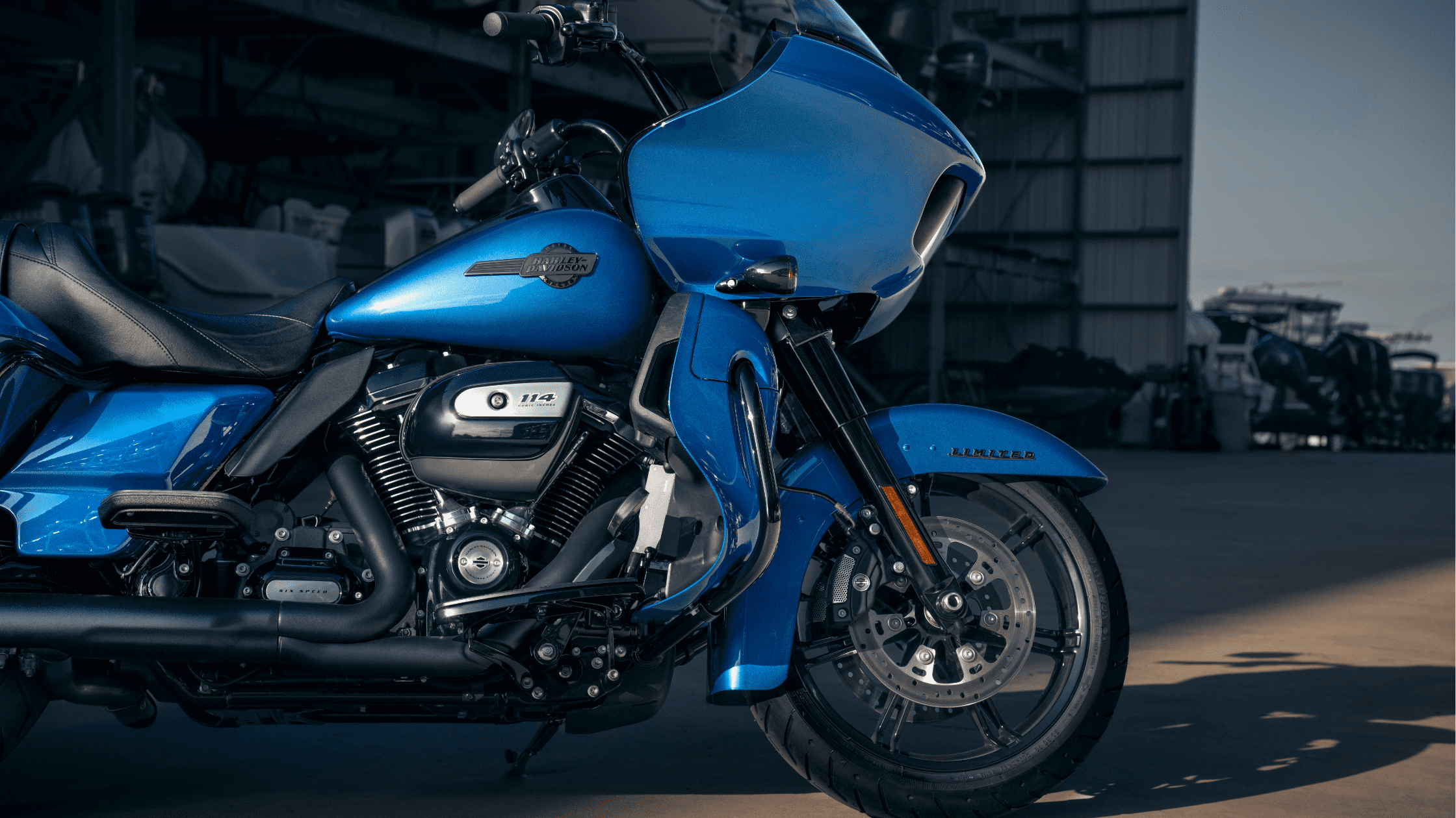 Side view of a blue Harley-Davidson Road Glide® Limited in a garage