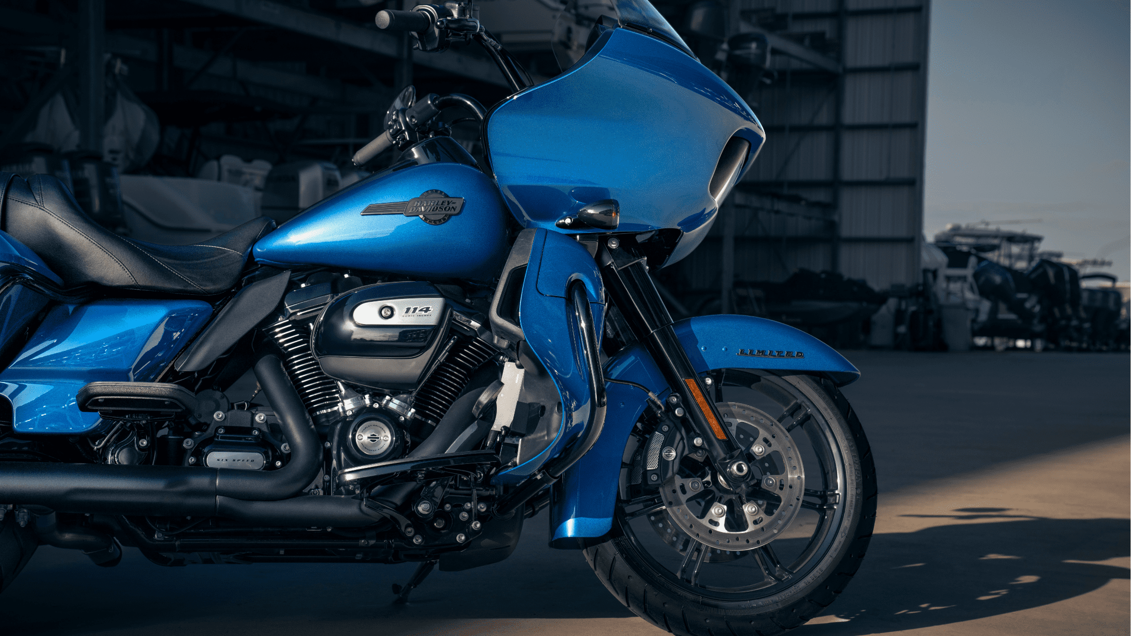 Close-up of a blue Harley-Davidson Road Glide® Limited motorcycle highlighting the engine and front fairing.