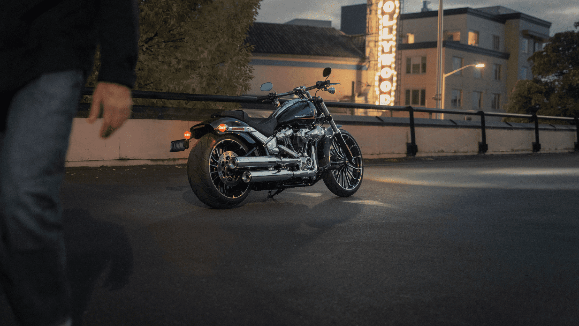 Harley-Davidson Breakout® 117 parked on a street at night with Hollywood sign in the background