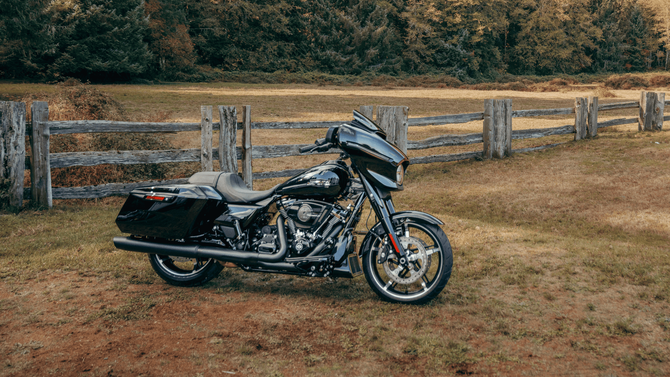 2024 Harley-Davidson® Street Glide® parked in a scenic countryside, highlighting its sleek design and touring features