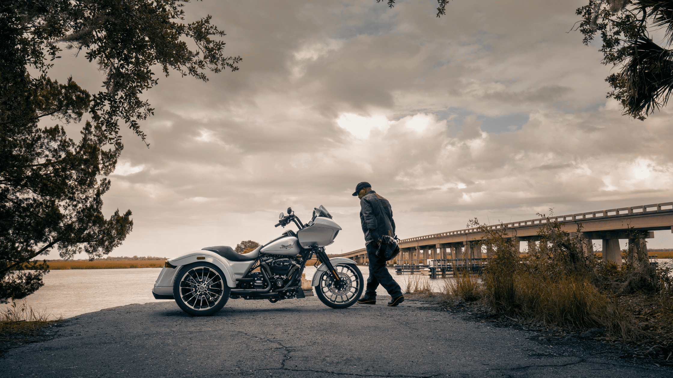2024 Harley-Davidson® Road Glide® 3 parked by the water, showcasing trike design.