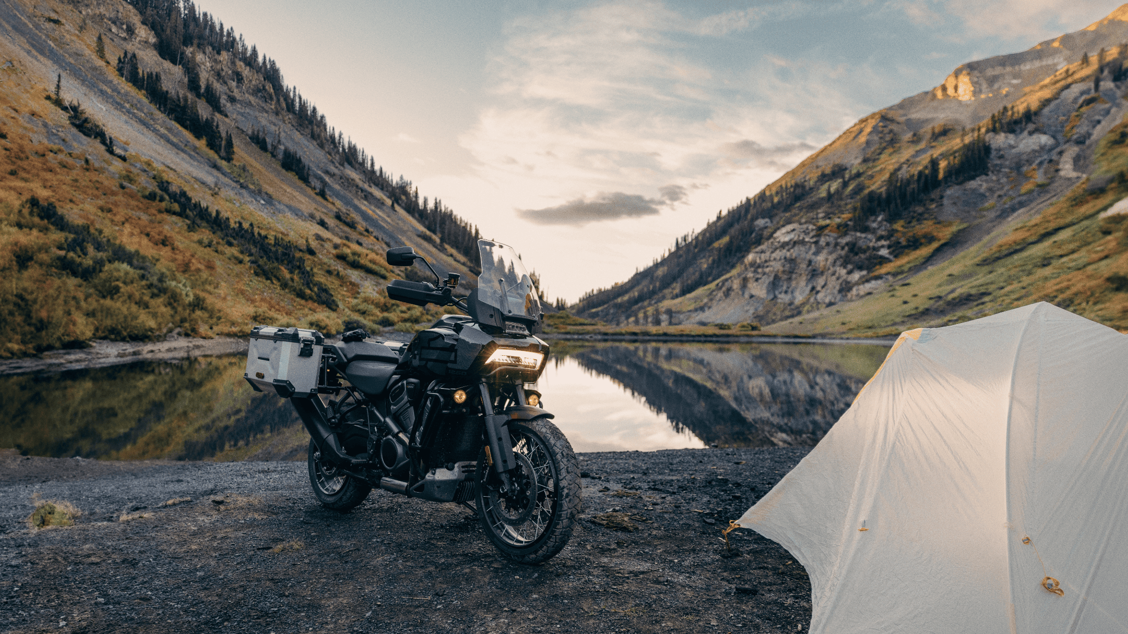 2024 Harley-Davidson® Pan America® 1250 Special parked by a scenic lake, built for adventure.