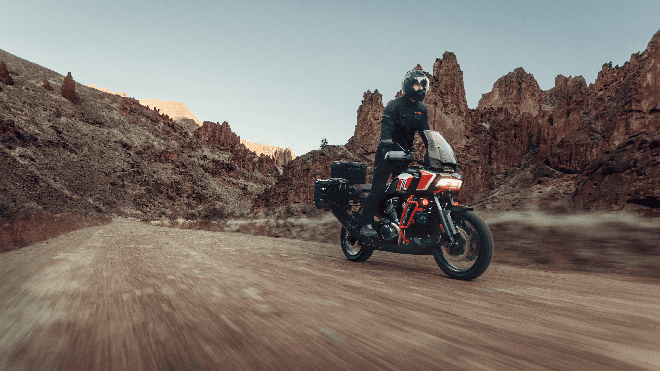 2024 Harley-Davidson® CVO™ Pan America® riding through rugged canyons, built for adventure.