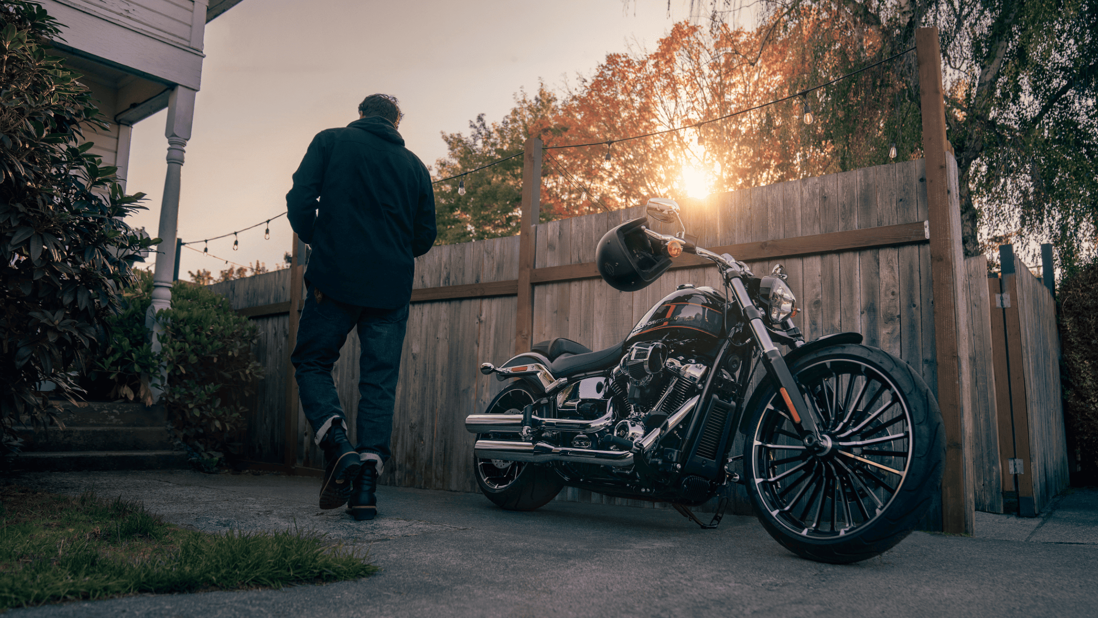 2024 Harley-Davidson® Breakout® 117 parked in a driveway, showcasing bold and muscular design