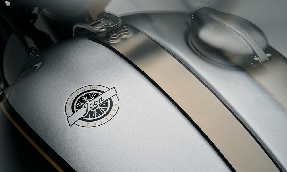 Close up top down image of a Triumphs fuel tank in aluminium silver featuring the icons edition logo