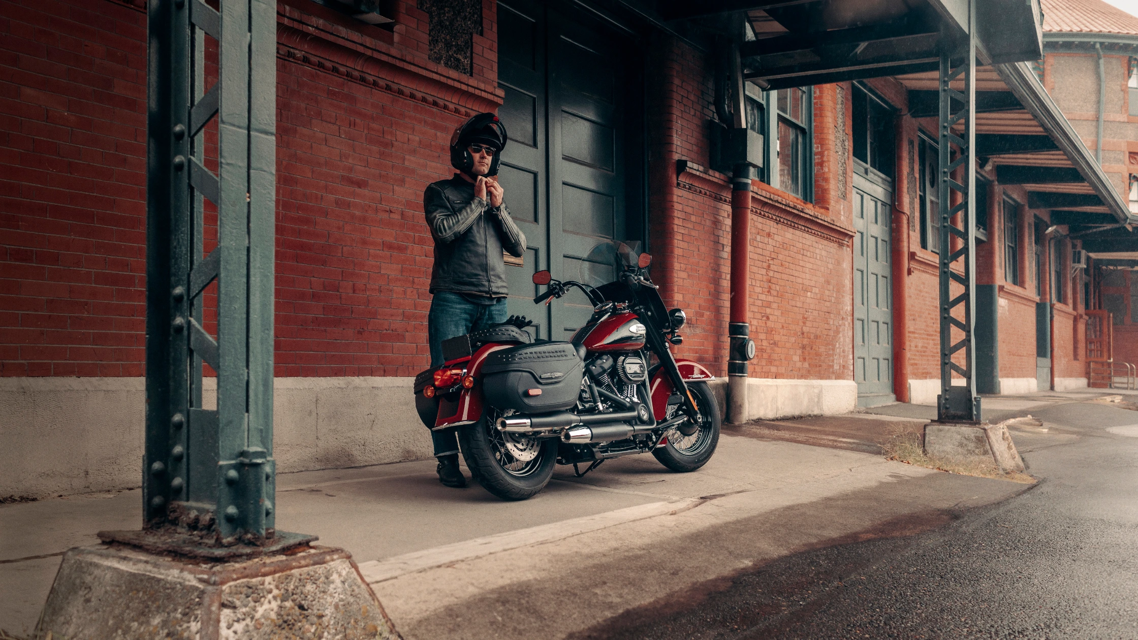 Rider preparing to set off on a 2024 Harley-Davidson® Heritage Classic 114 motorcycle near Bentonville, AR, featuring classic styling and touring capabilities.