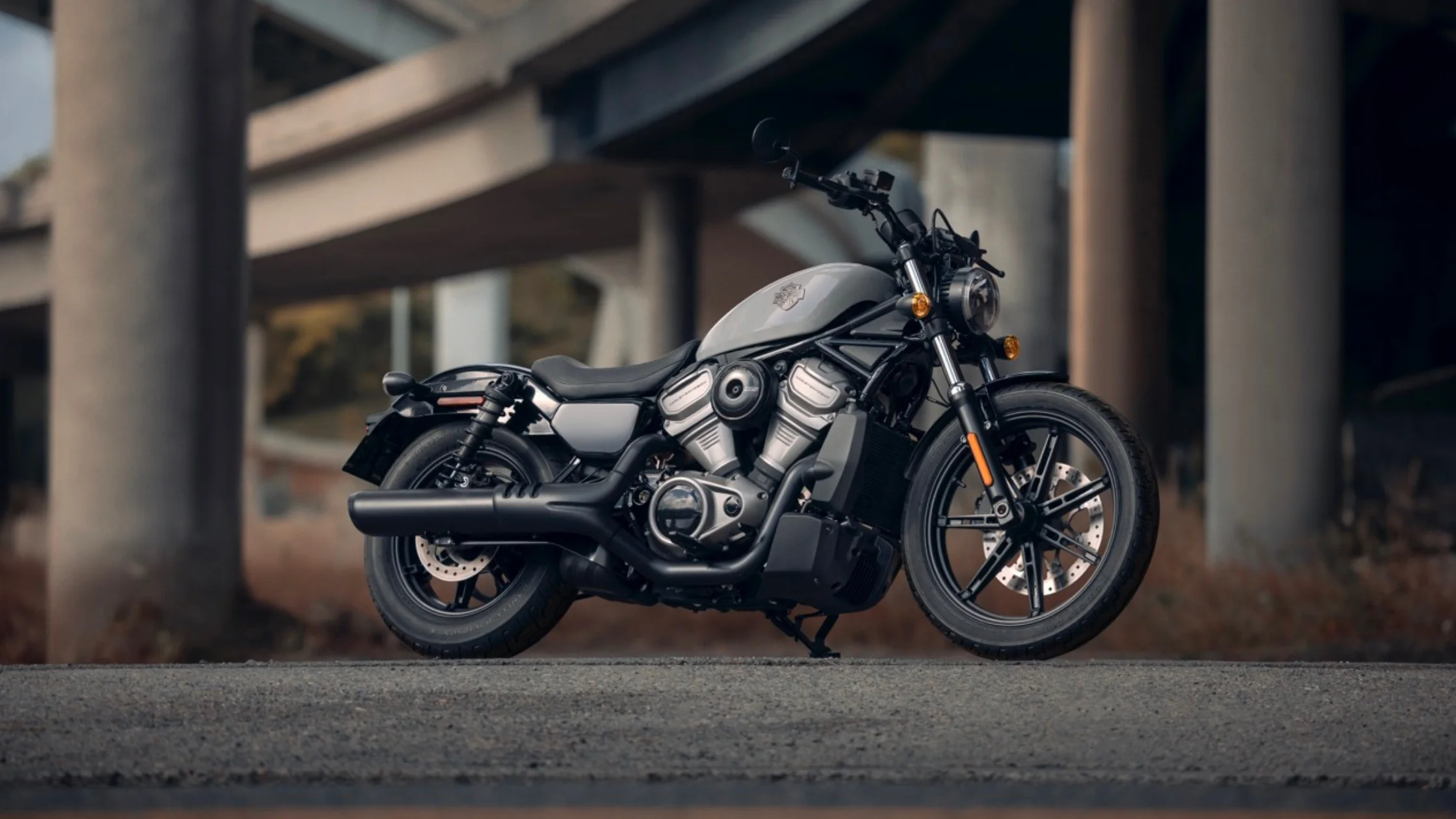Harley-Davidson Nightster® motorcycle in urban setting under bridge.