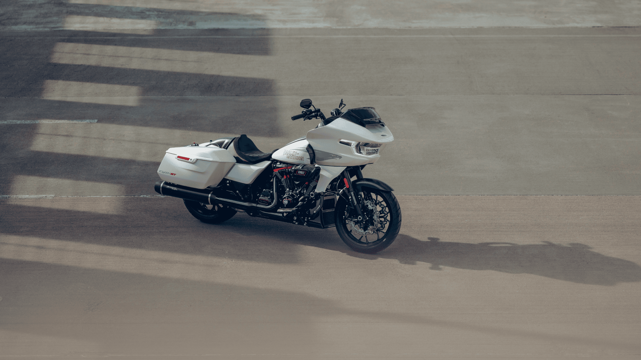 2024 Harley-Davidson® CVO™ Road Glide® ST in white, parked on open pavement.