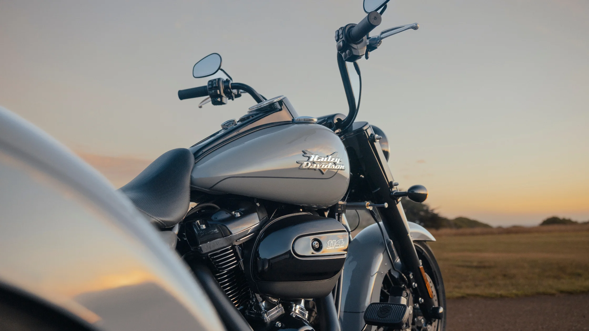 Harley-Davidson® Freewheeler® close-up showcasing iconic design at sunset.