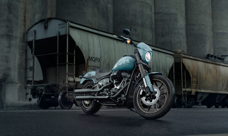 2024 Harley-Davidson Low Rider S parked by a train