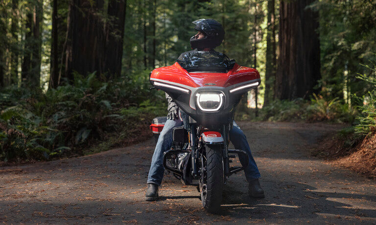 2024 Harley-Davidson CVO Street Glide head on in forest with rider 