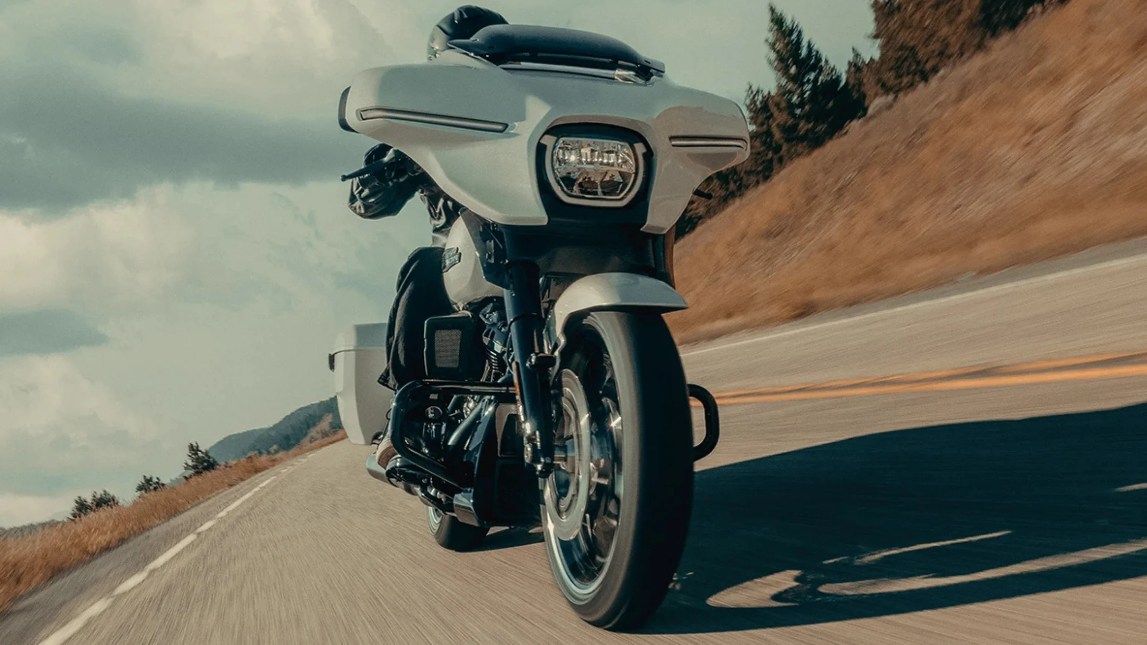 Harley-Davidson Street Glide in white, cruising on an open road