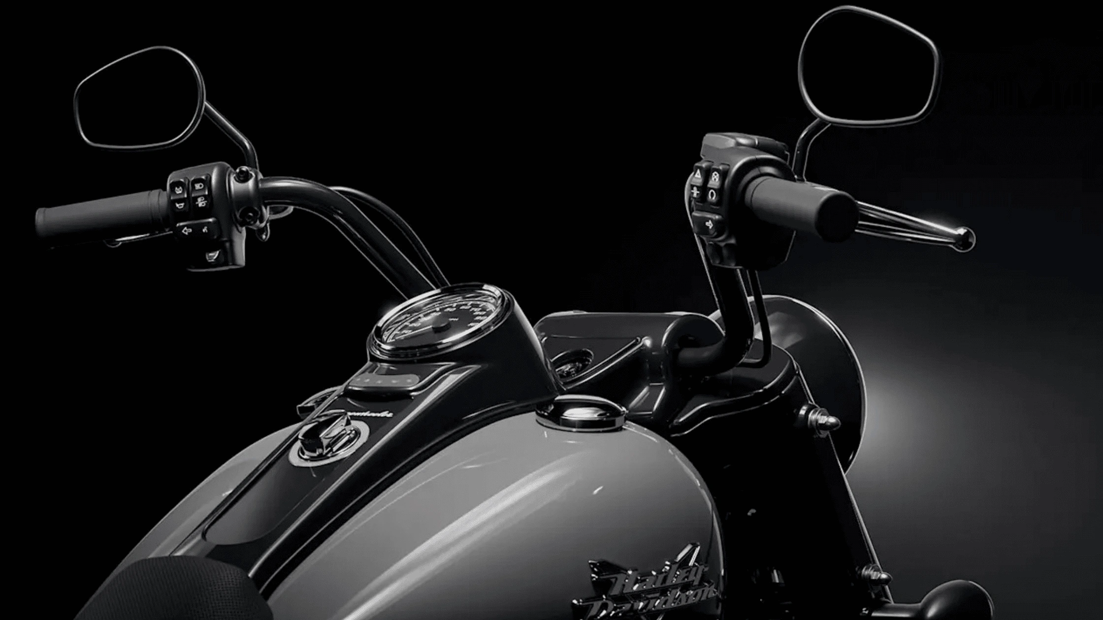Text: A close-up view of the handlebars and controls of the 2025 Harley-Davidson® Freewheeler®, emphasizing its premium craftsmanship and functionality.