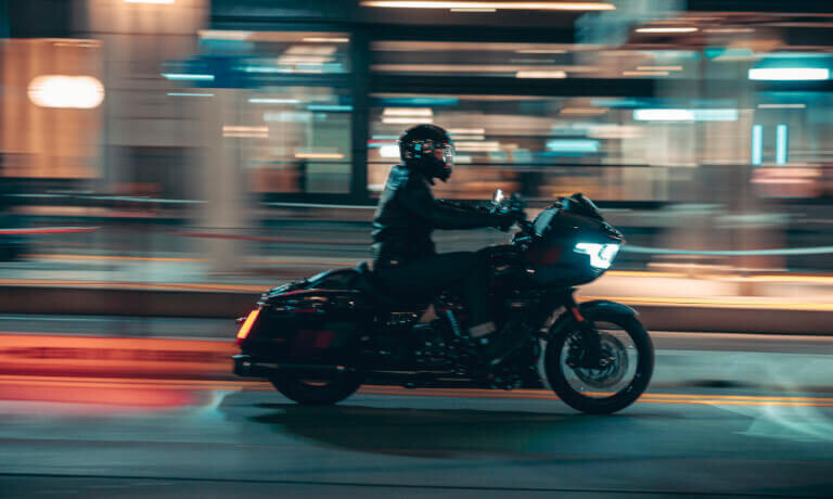 2025 Harley-Davidson CVO Road Glide ST riding fast in blurred city