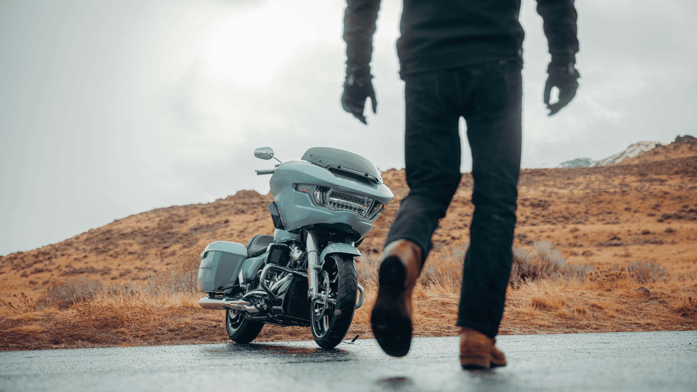 2025 Harley-Davidson® Road Glide® parked on an open road in Rogers, AR, featuring a sleek design and powerful performance.