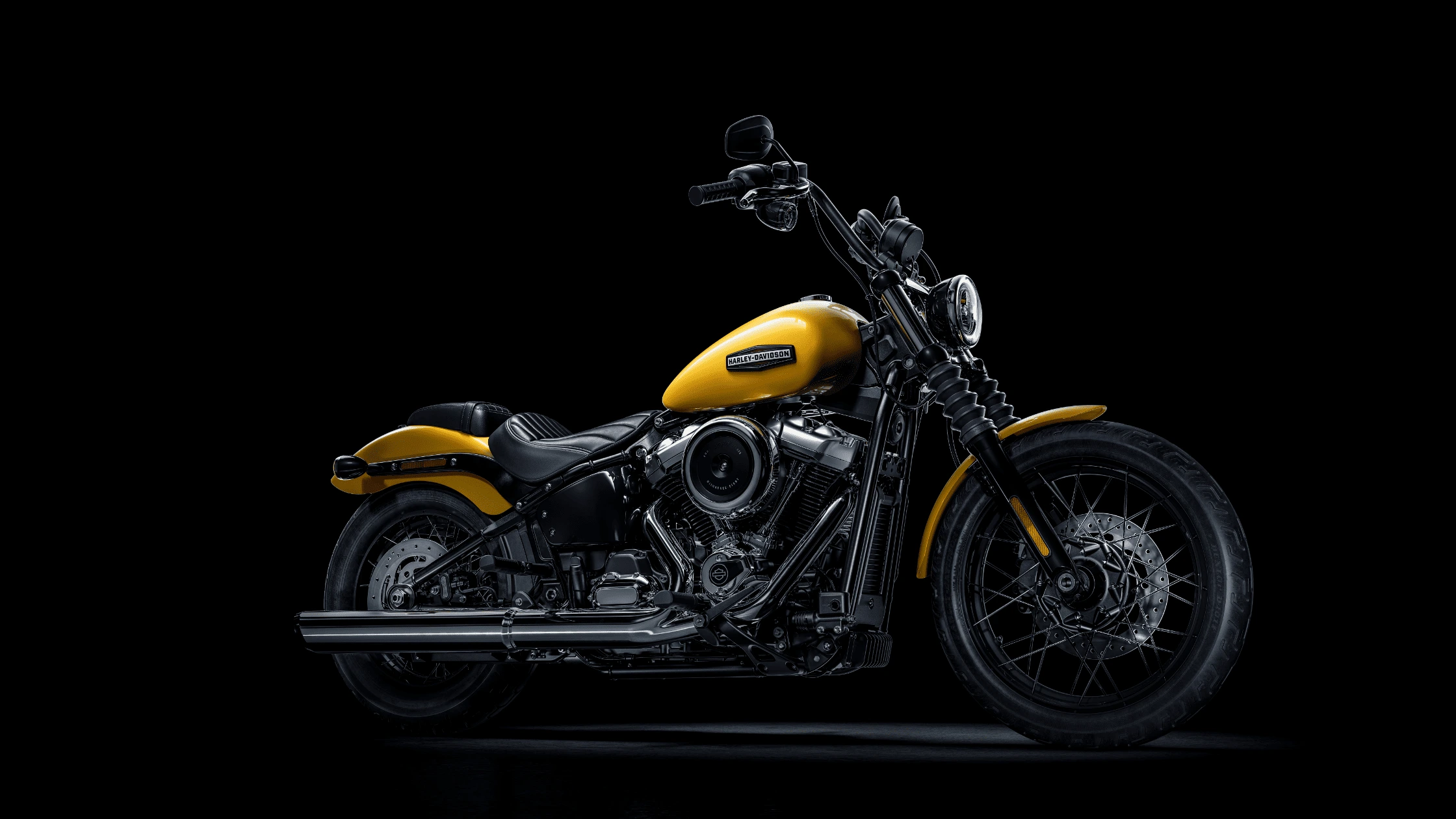2025 Harley-Davidson® Street Bob® in yellow, showcasing a minimalist design and Milwaukee-Eight® engine in Rogers, AR.
