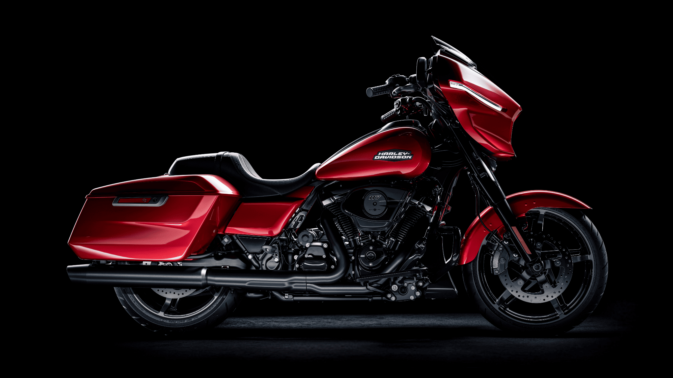 Studio view showcasing the vibrant red and sleek contours of the 2025 Harley-Davidson® Street Glide®.