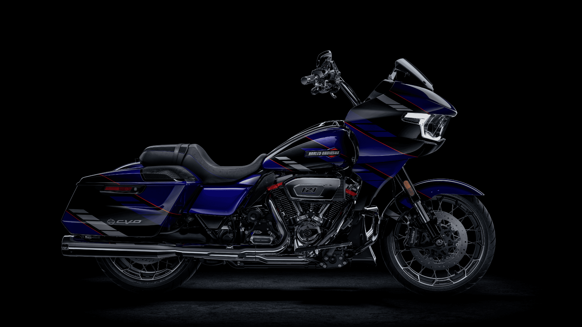 Studio photo of a striking dark blue and black 2025 Harley-Davidson® CVO™ Road Glide® against black.
