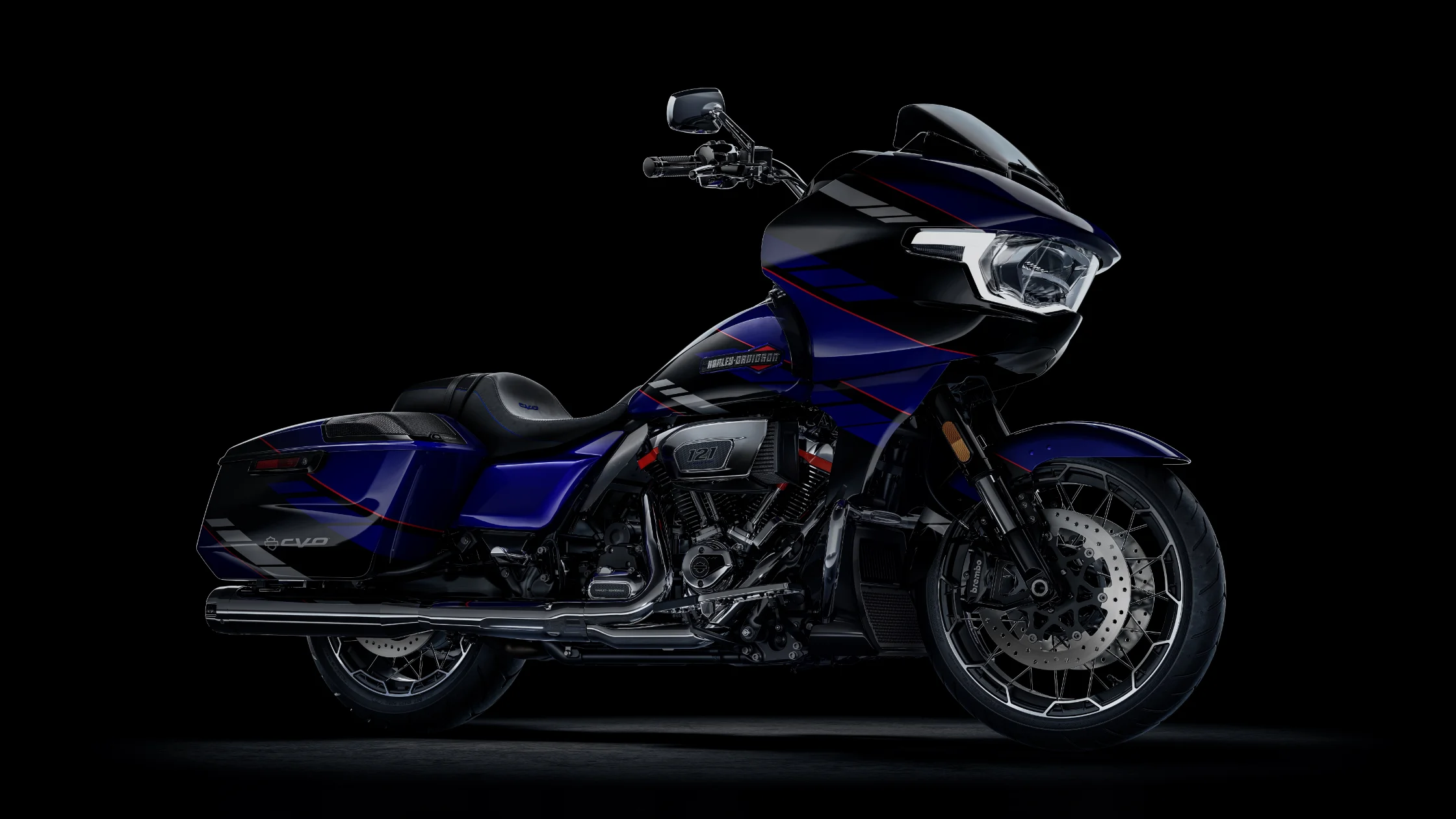 A 2025 Harley-Davidson CVO Road Glide in a striking blue and black color scheme with sleek red accents.