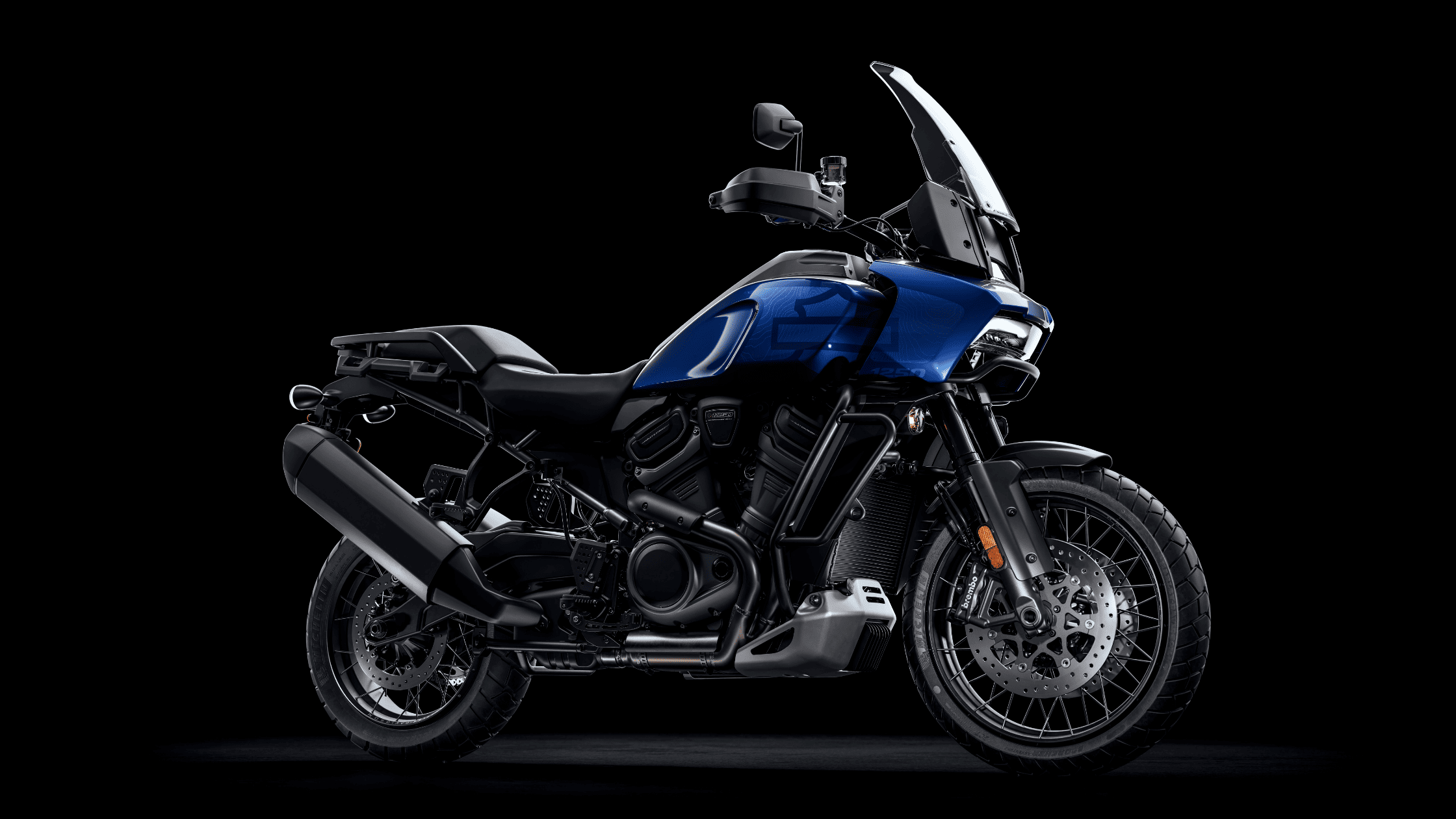 Side view of a blue 2025 Harley-Davidson® Pan America® 1250 Special adventure touring motorcycle.