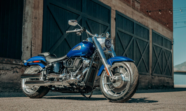 2025 Harley-Davidson Fat Boy parked outside a warehouse
