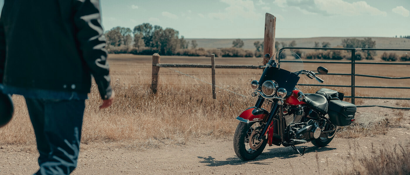 2025 Harley-Davidson Heritage Classic parked by a fence