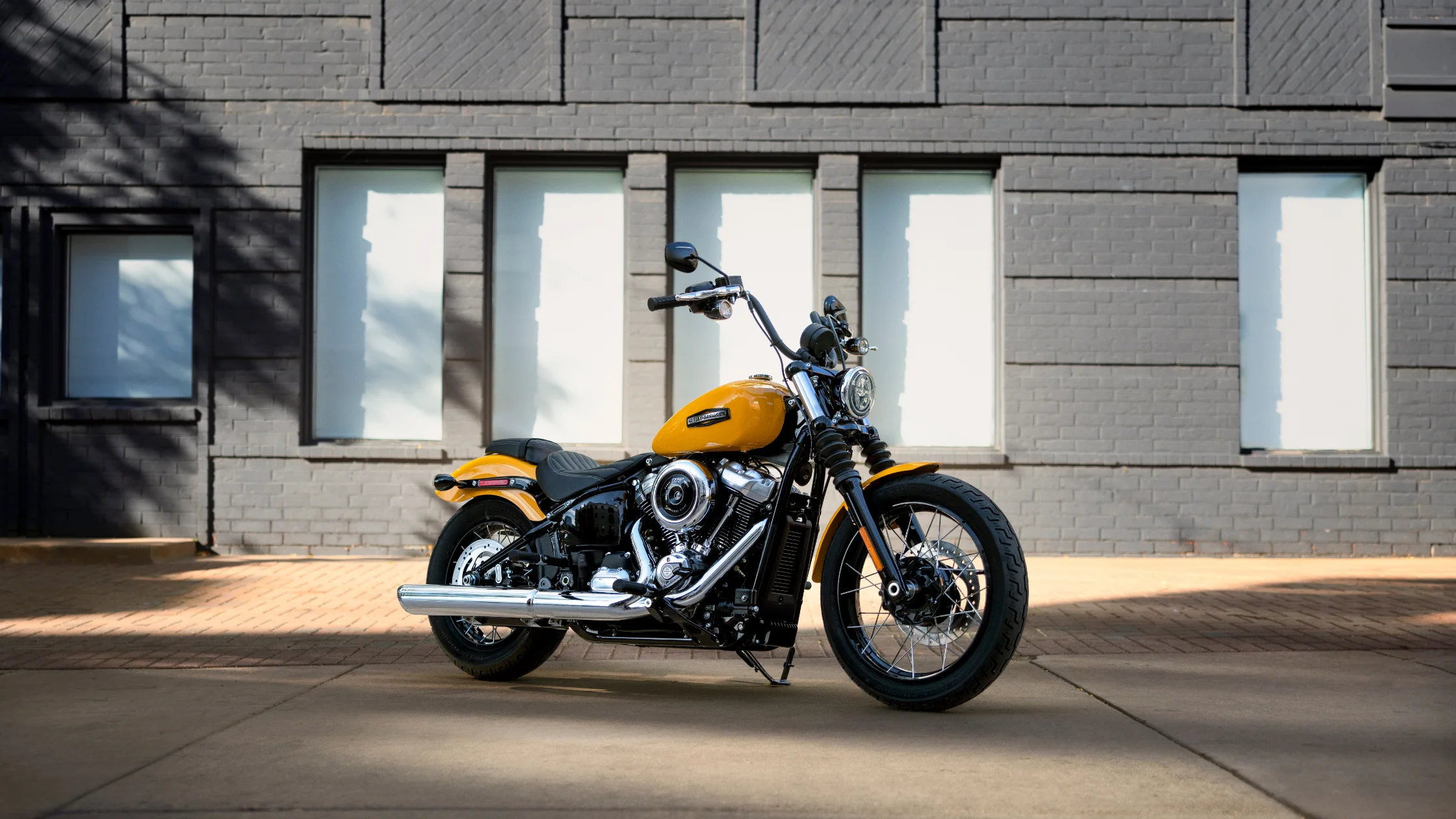 2025 Harley-Davidson Street Glide Ultra in blue parked on open road with mountains in background