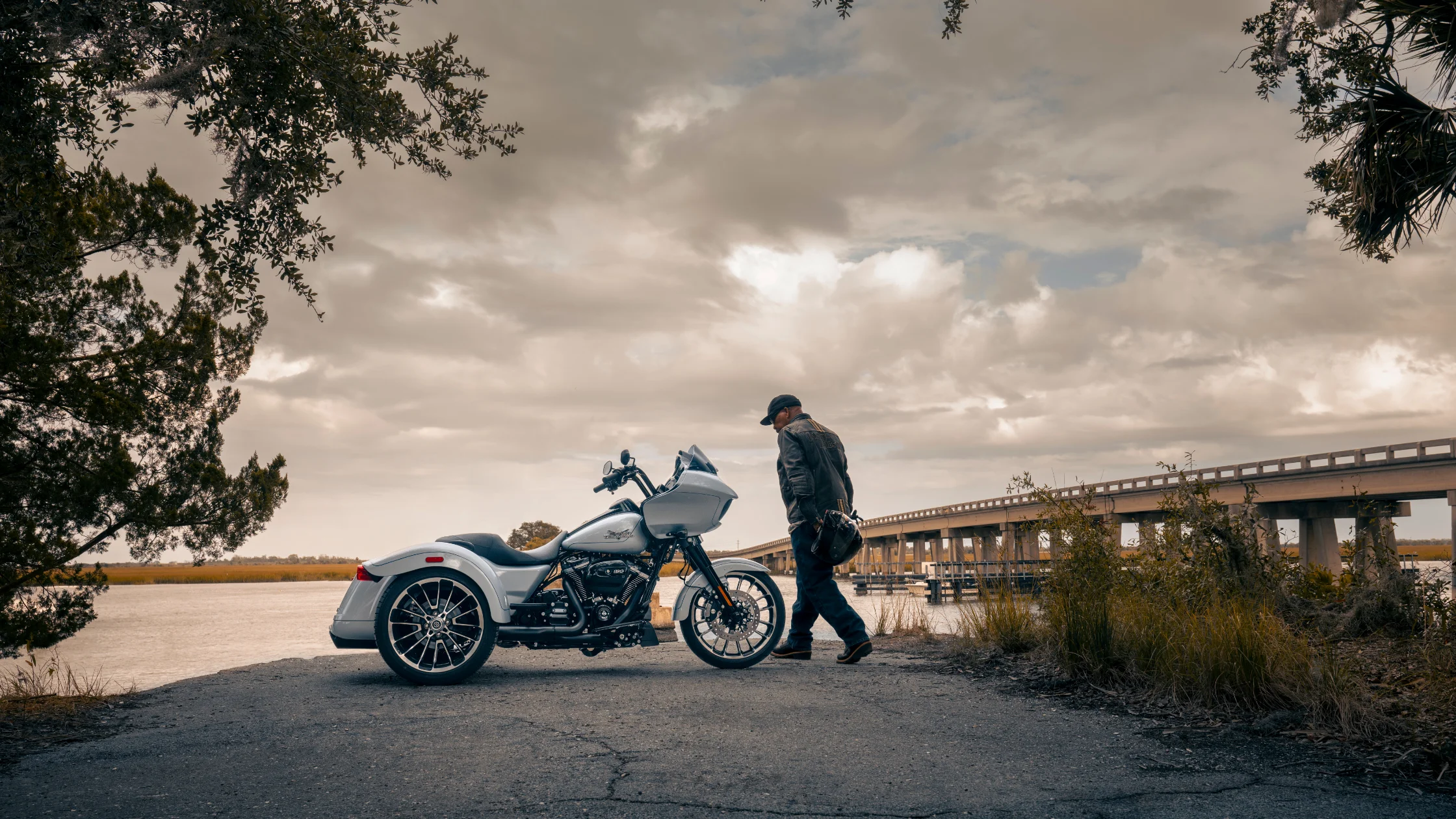2025 Harley-Davidson® Road Glide® 3 trike parked near a river under cloudy sky
