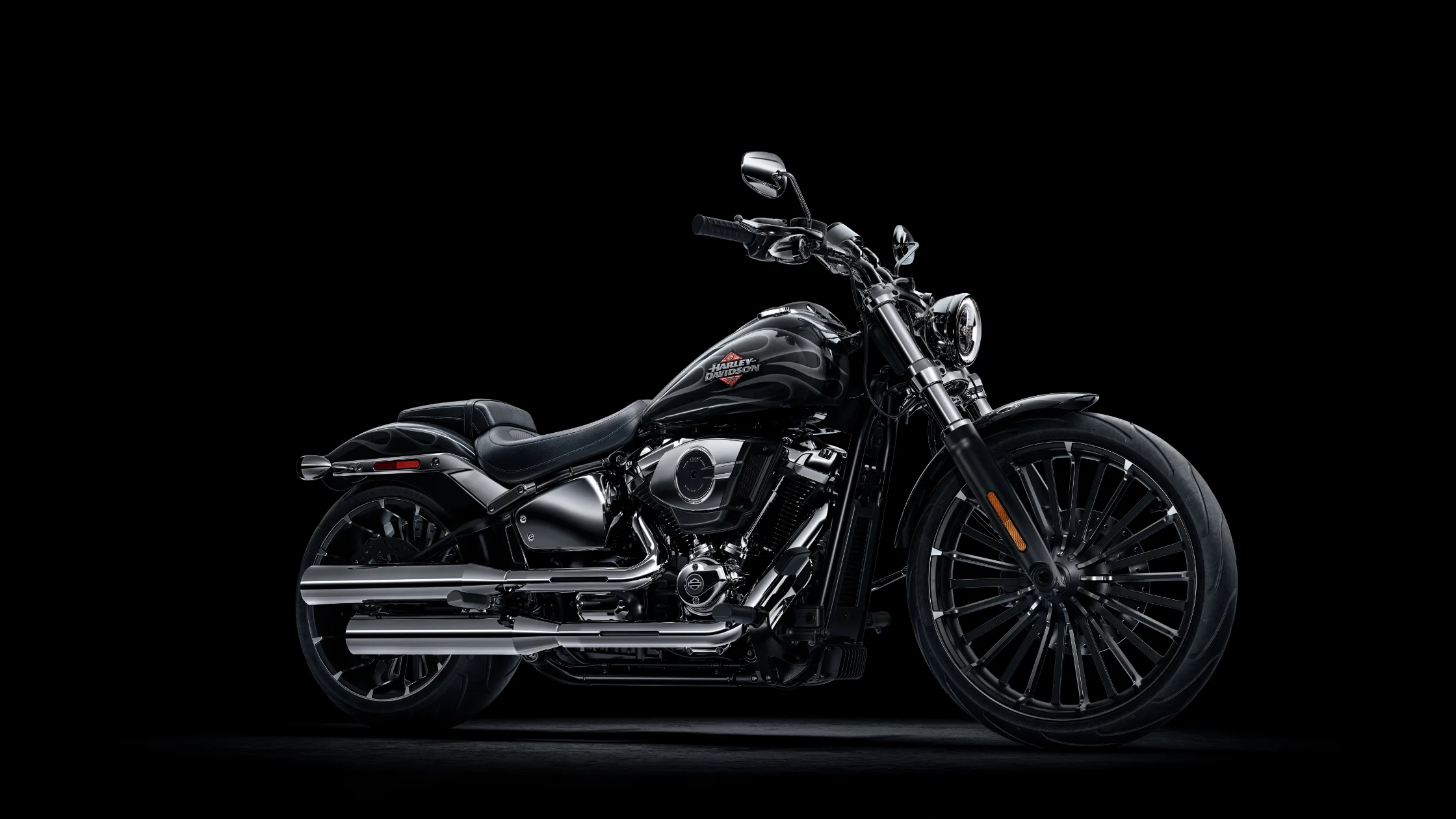 2025 Harley-Davidson Breakout cruiser with blacked-out styling and chrome dual exhausts