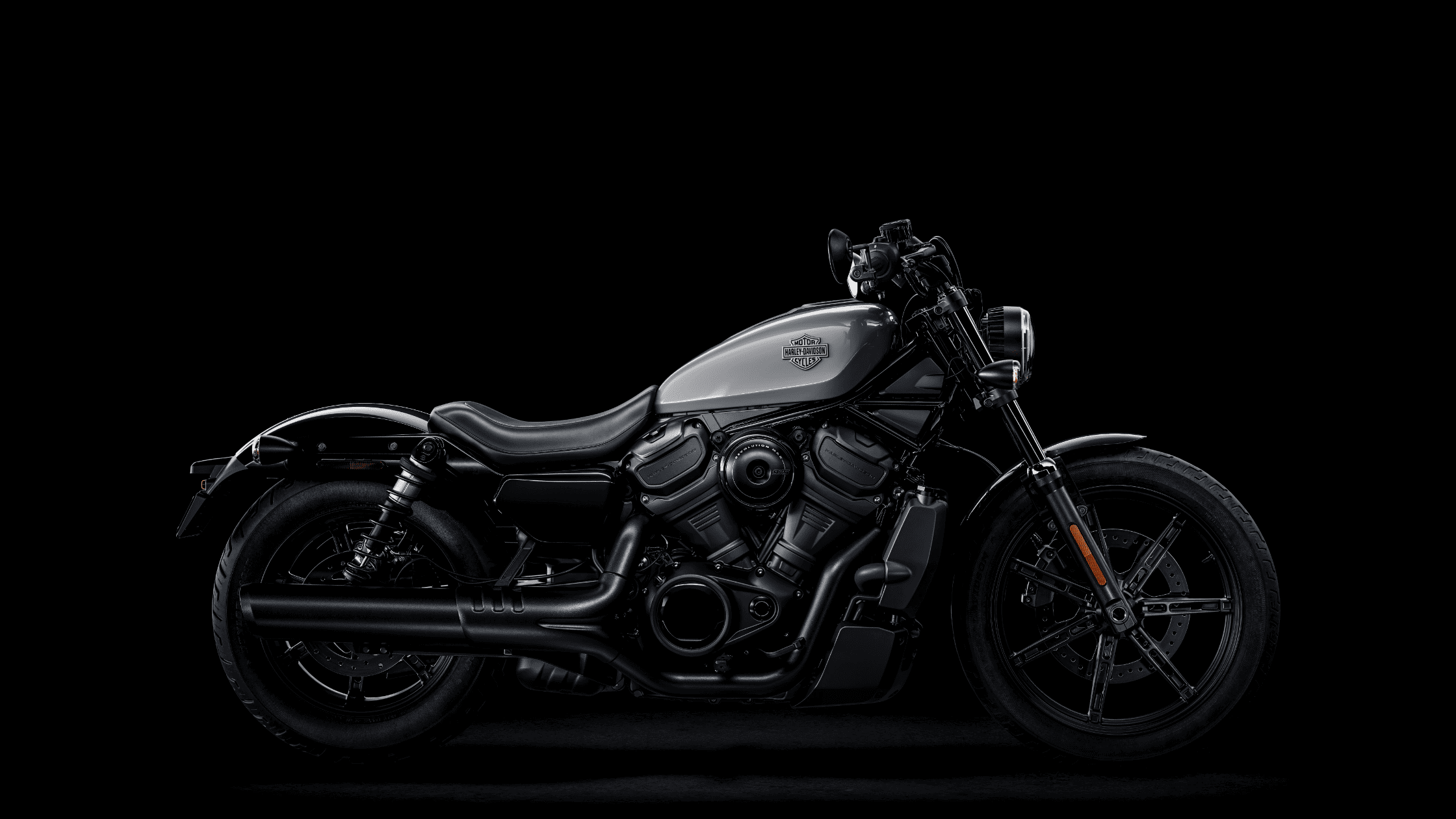 2025 Harley-Davidson® Nightster® in silver with liquid-cooled Revolution® Max engine, low-profile stance, and blacked-out exhaust.