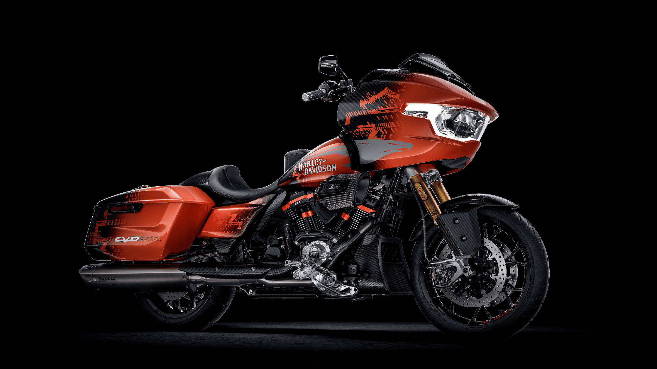 2025 Harley-Davidson® CVO™ Road Glide® RR in orange and black with performance suspension, Milwaukee-Eight® 121 V-Twin engine, and sport-inspired graphics.