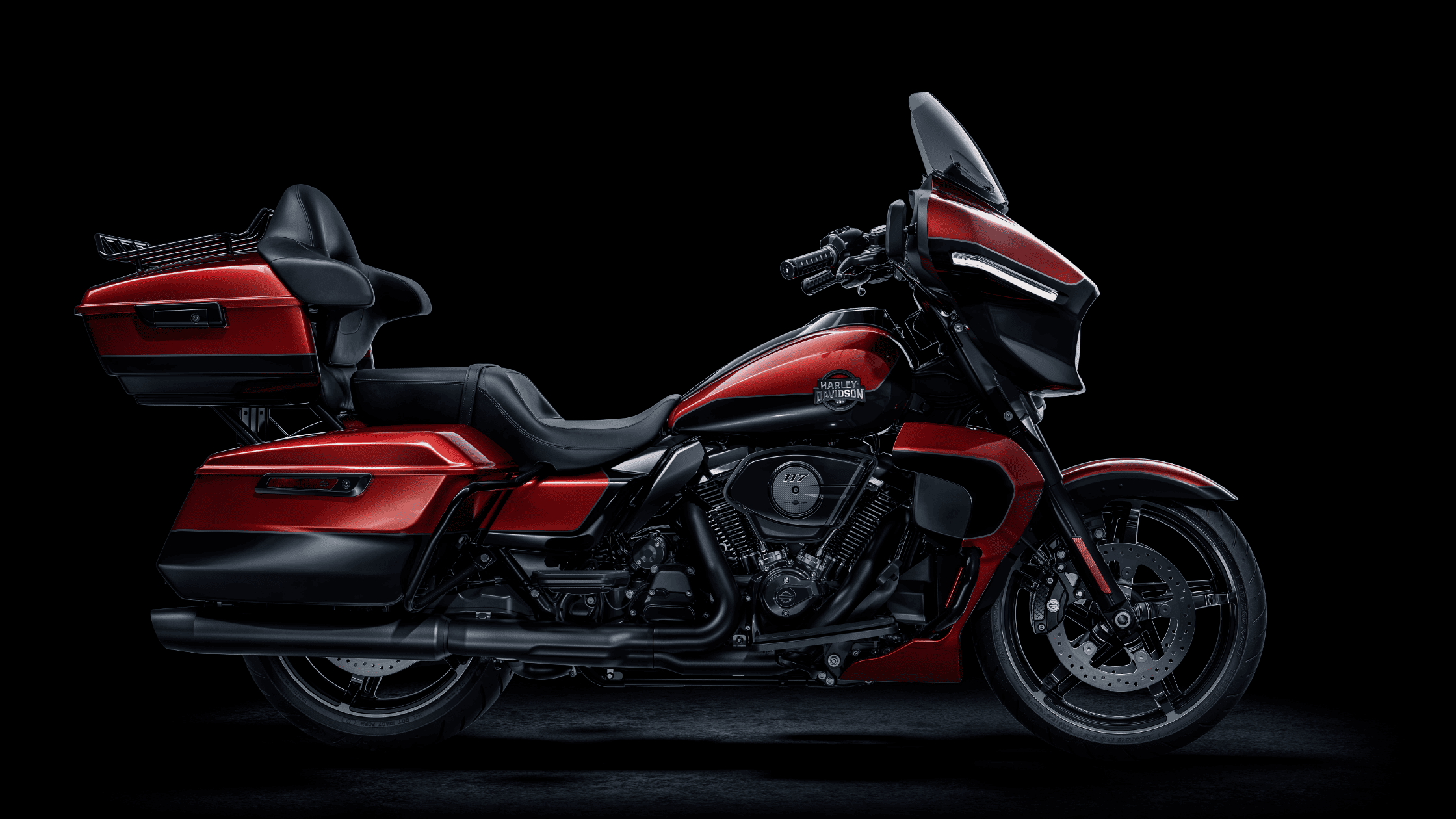 2025 Harley-Davidson Street Glide Ultra in red and black with touring trunk, saddlebags, and passenger backrest
