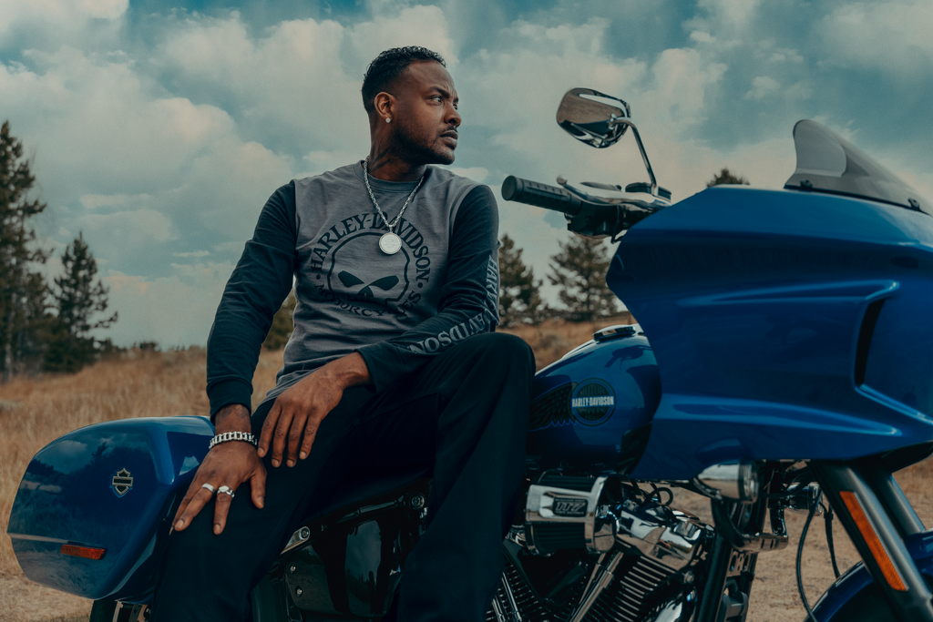 Harley-Davidson rider with Genuine Motorclothes clothing and accessories on a Low Rider ST
