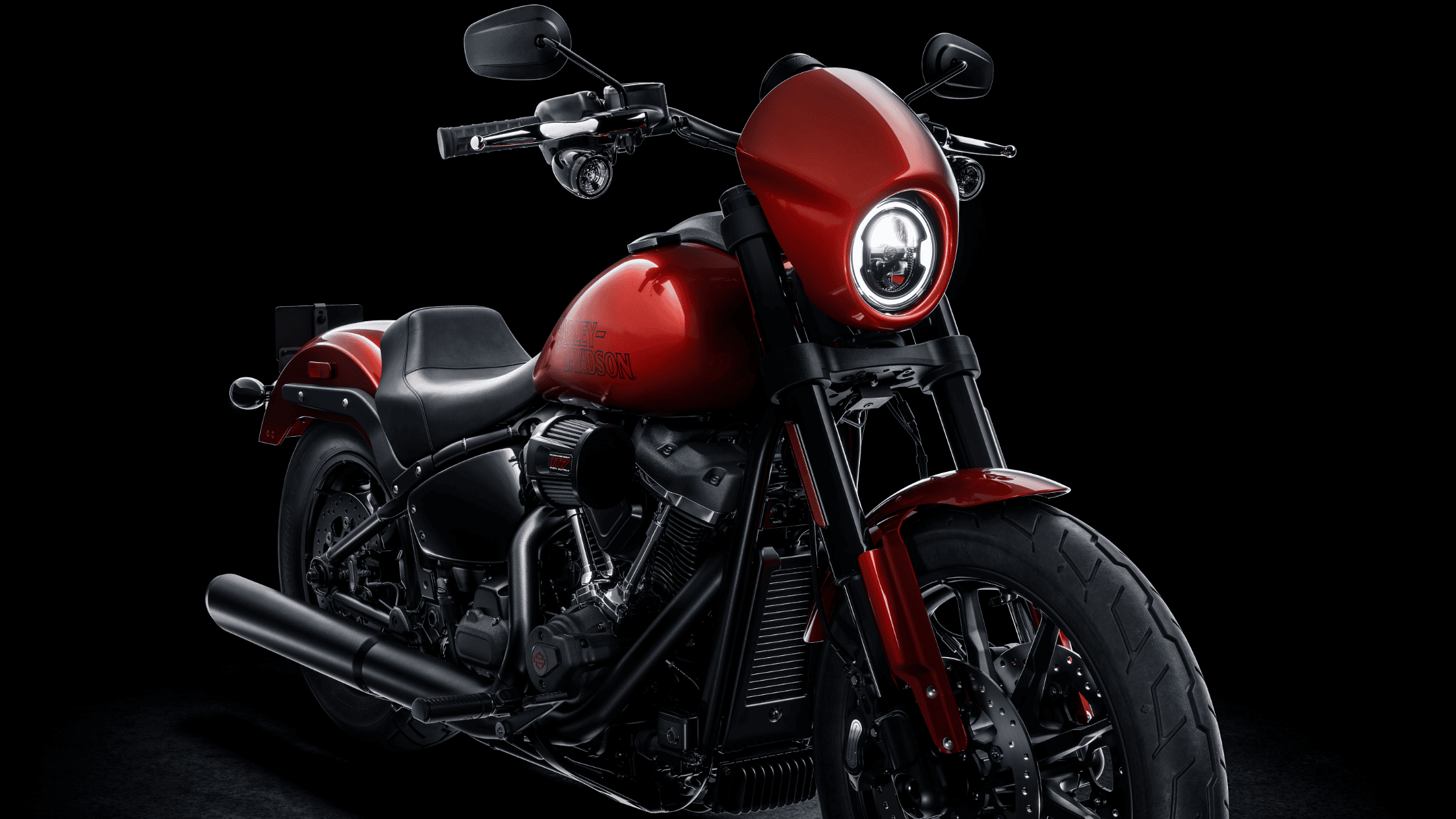 2025 Harley-Davidson® Low Rider® S in vivid red displayed on a black background near West Palm Beach, FL.
