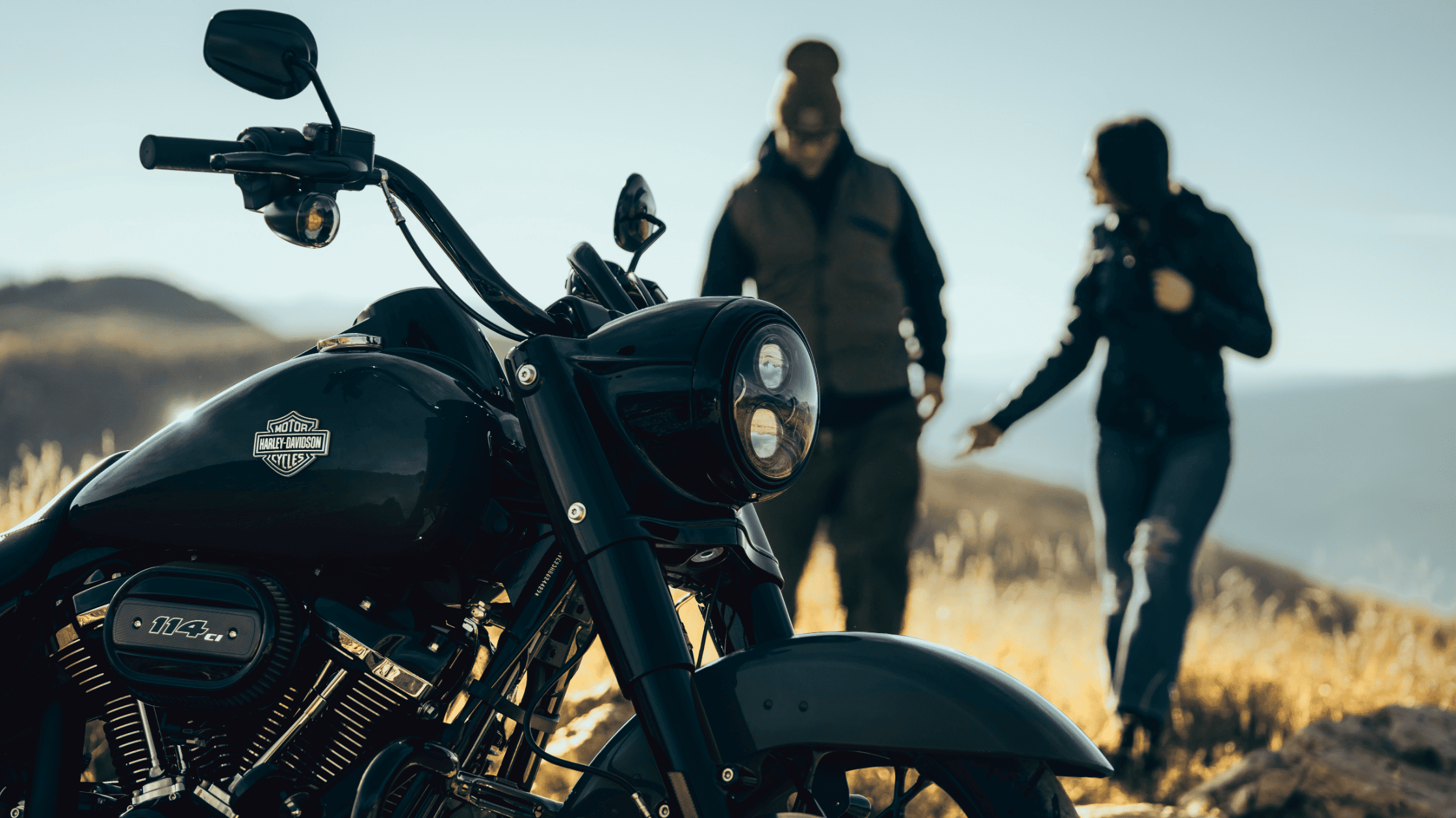 Close-up of a 2025 Harley-Davidson® Road King® Special in black with scenic hills in Bentonville, AR.