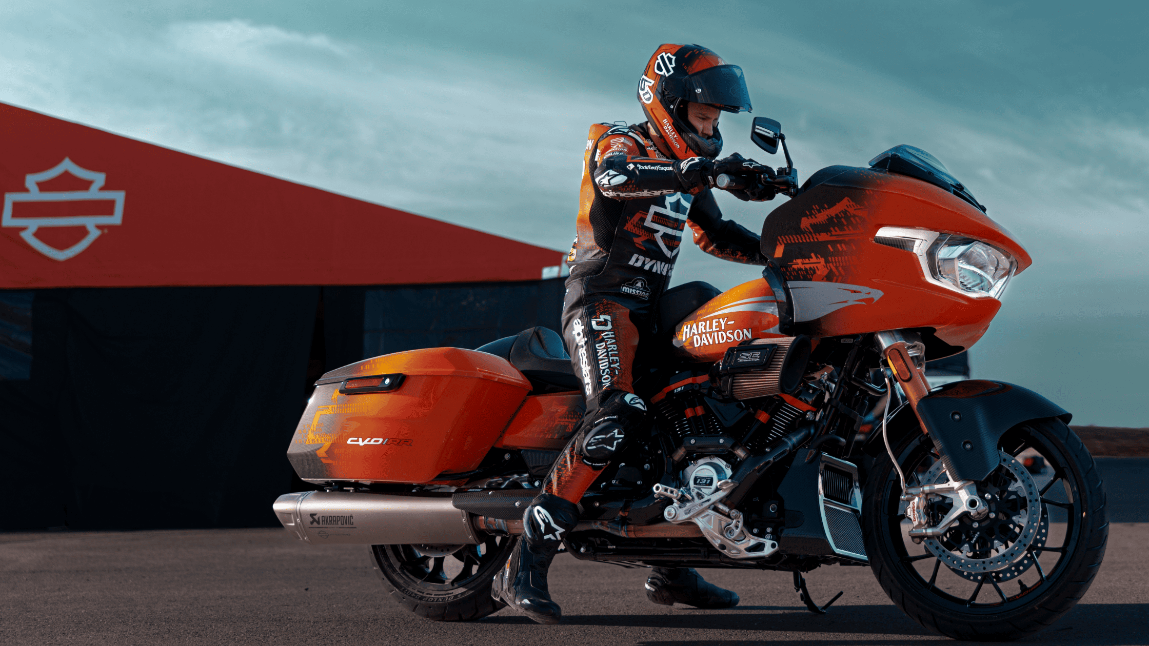 2025 Harley-Davidson® CVO™ Road Glide® RR in racing orange at a Harley-Davidson® track setup near Bentonville, AR.