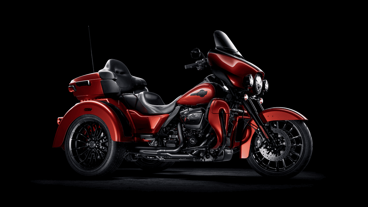 2025 Harley-Davidson® Tri Glide® Ultra in vivid red, designed for long-distance touring with added stability, seen near Orlando, FL.