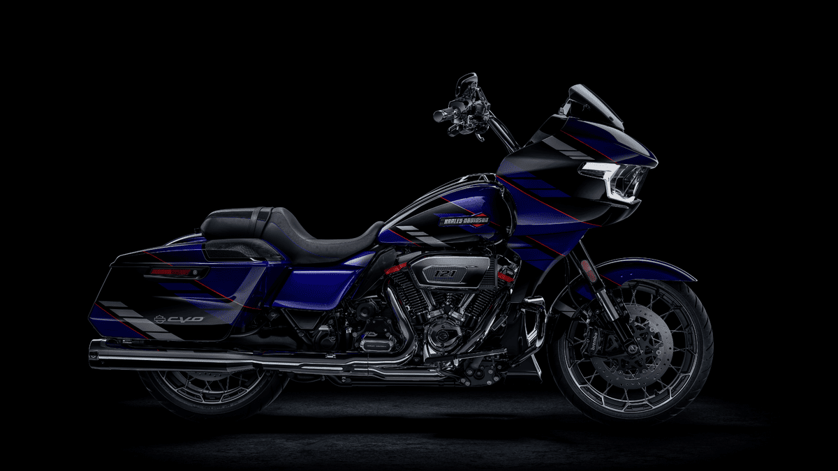 2025 Harley-Davidson® CVO™ Road Glide® in blue & black paint scheme, showcased near Orlando FL, featuring aggressive touring style.