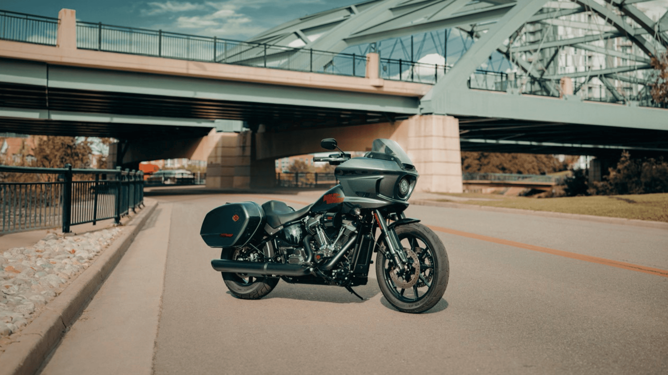 2025 Low Rider ST motorcycle in sleek black finish parked under urban bridge with modern design
